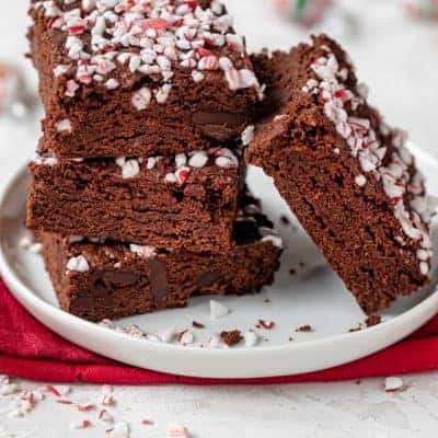 Final vegan peppermint brownies stacked on a small plate