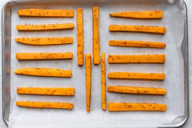 Fries on a baking sheet before baking