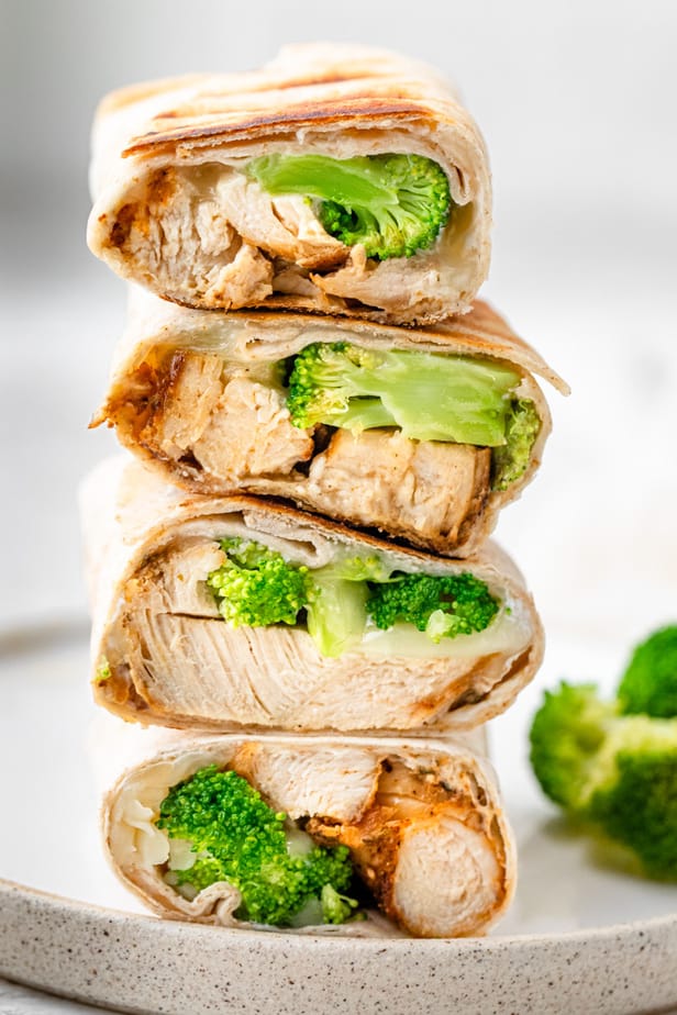Chicken and broccoli wraps stacked on top of each other