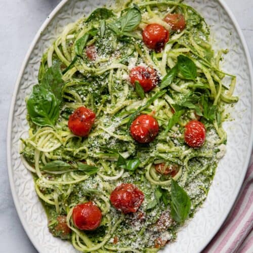 Large plate of zoodles with blistered tomatoes