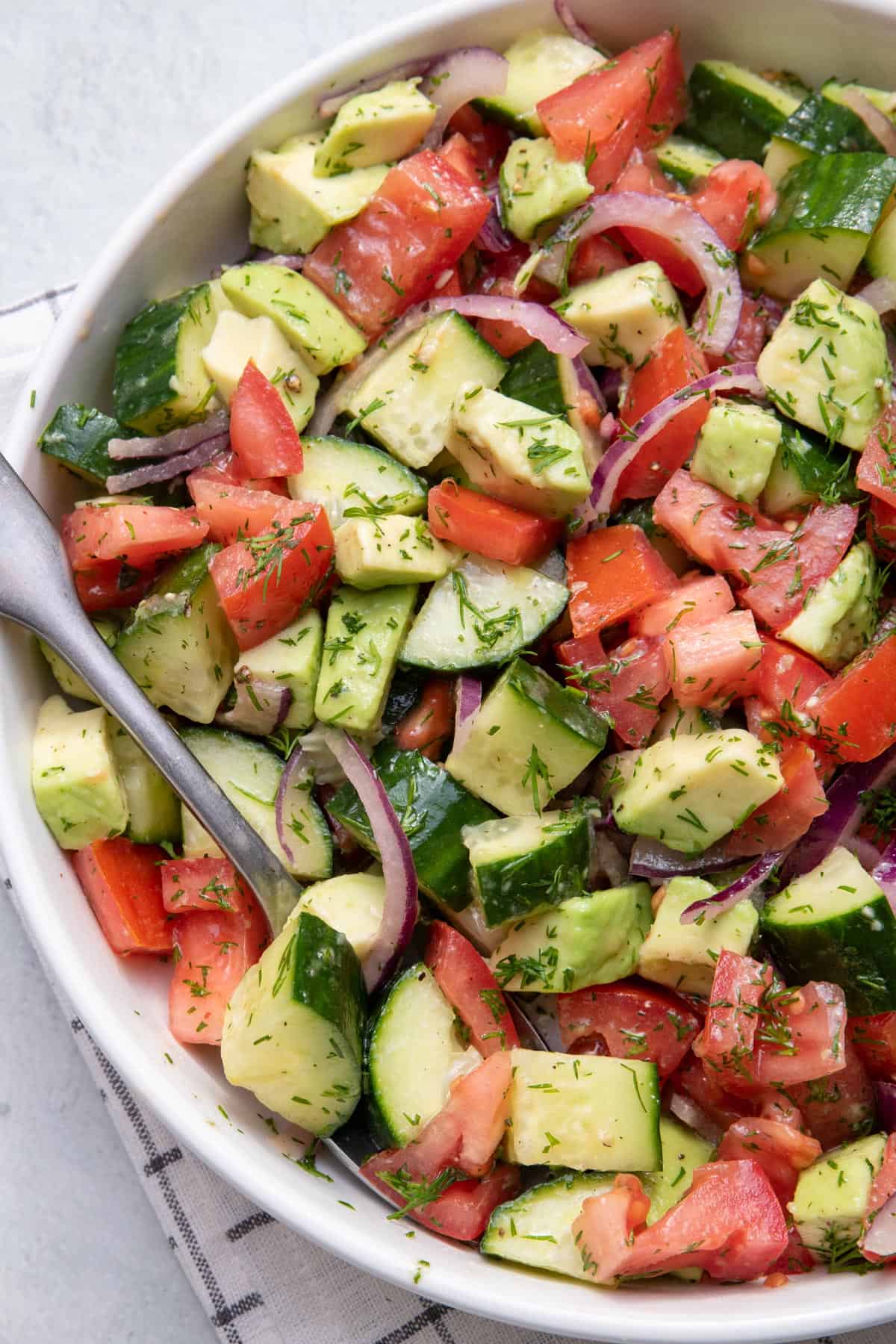 Close up shot of tomato cucumber avocado salad