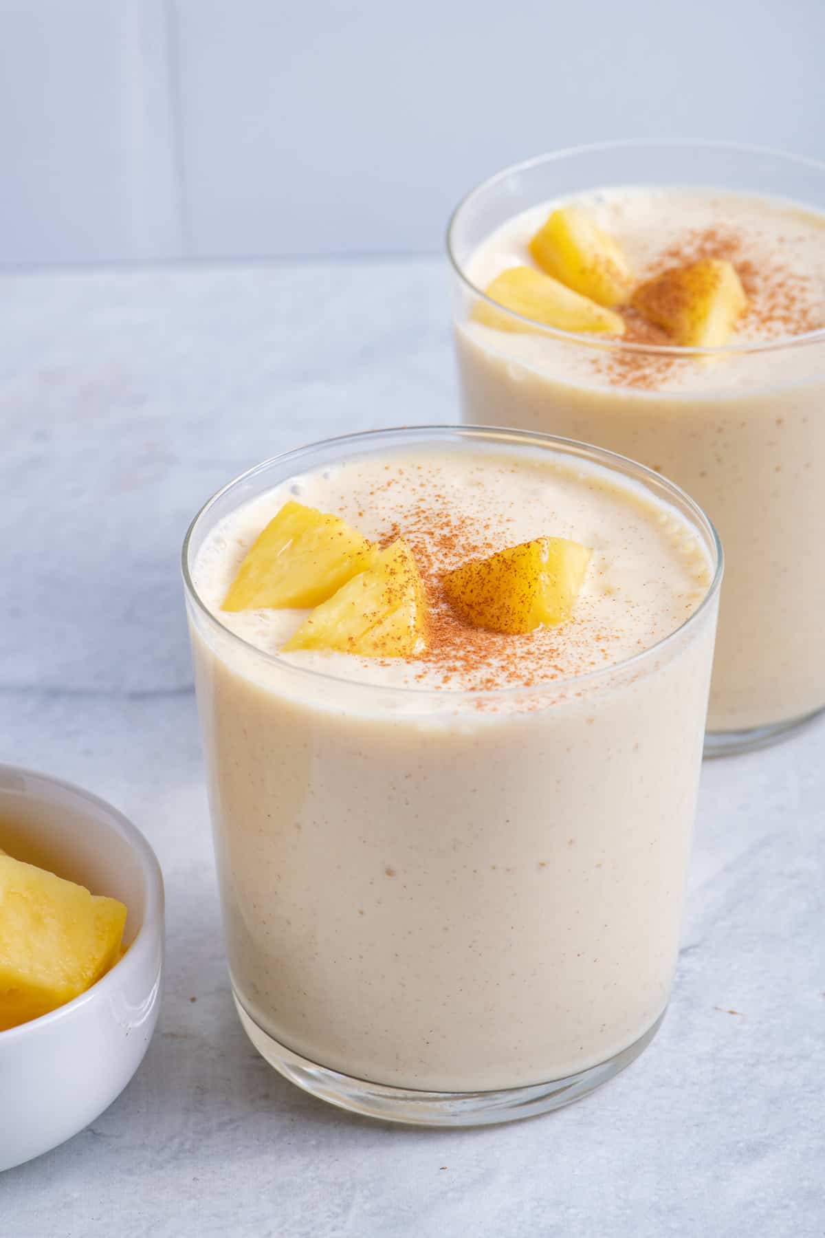 Mango Pineapple Coconut Smoothie in a cup