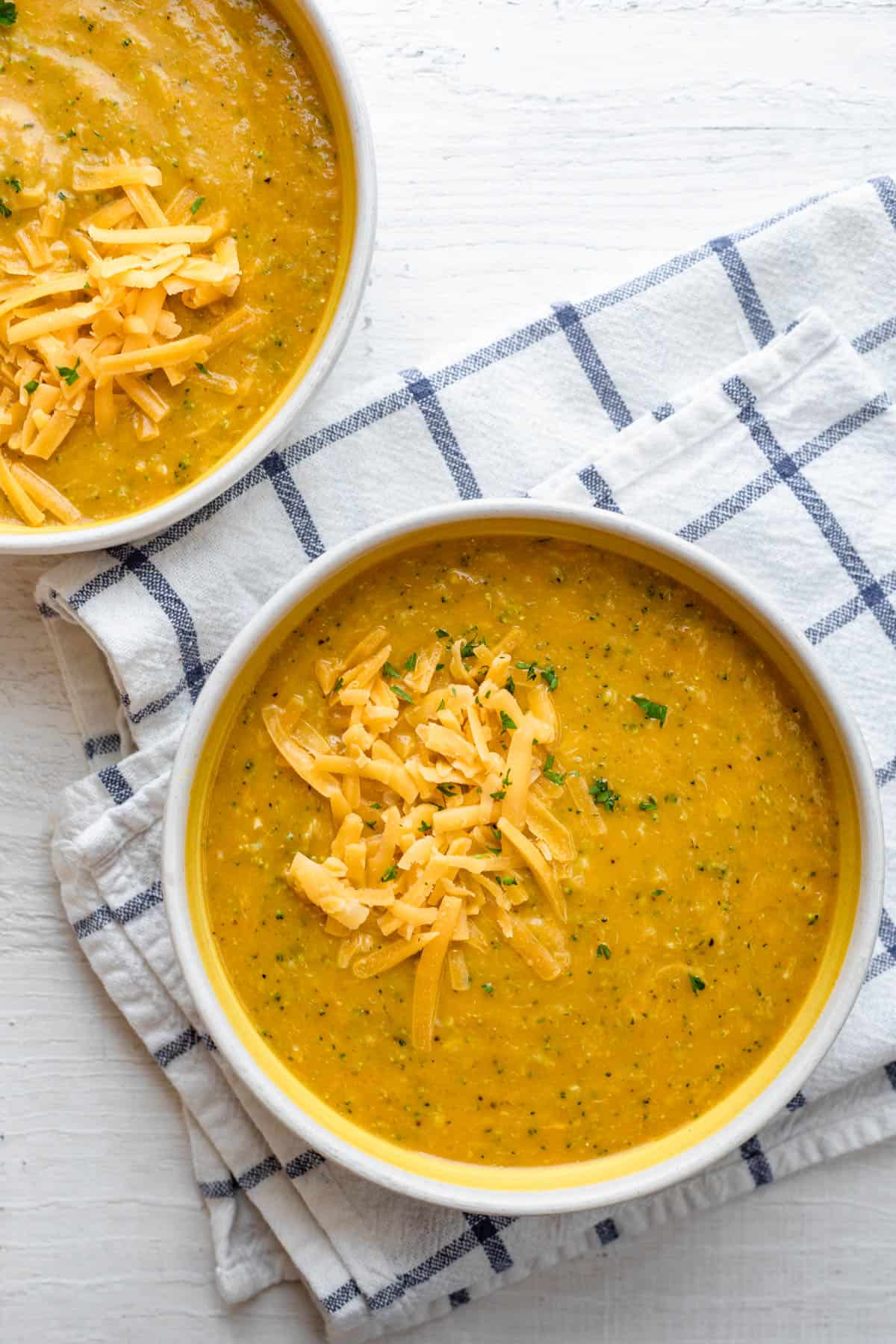 Healthy Broccoli and Cheese Soup in a bowl with a spoon next to it