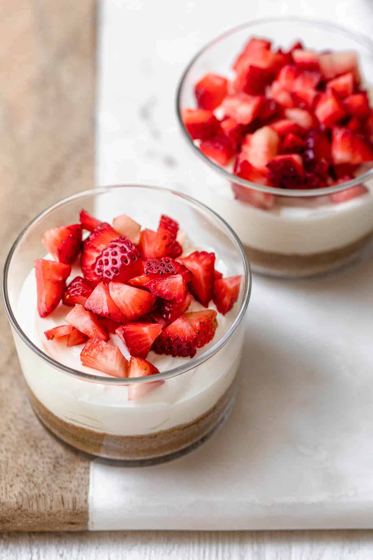 Pots of Greek Yogurt Cheesecake with strawberry topping