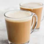 Two clear cups of coconut oil coffee