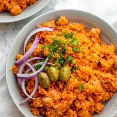 Mediterranean style bulgur pilaf in white bowls