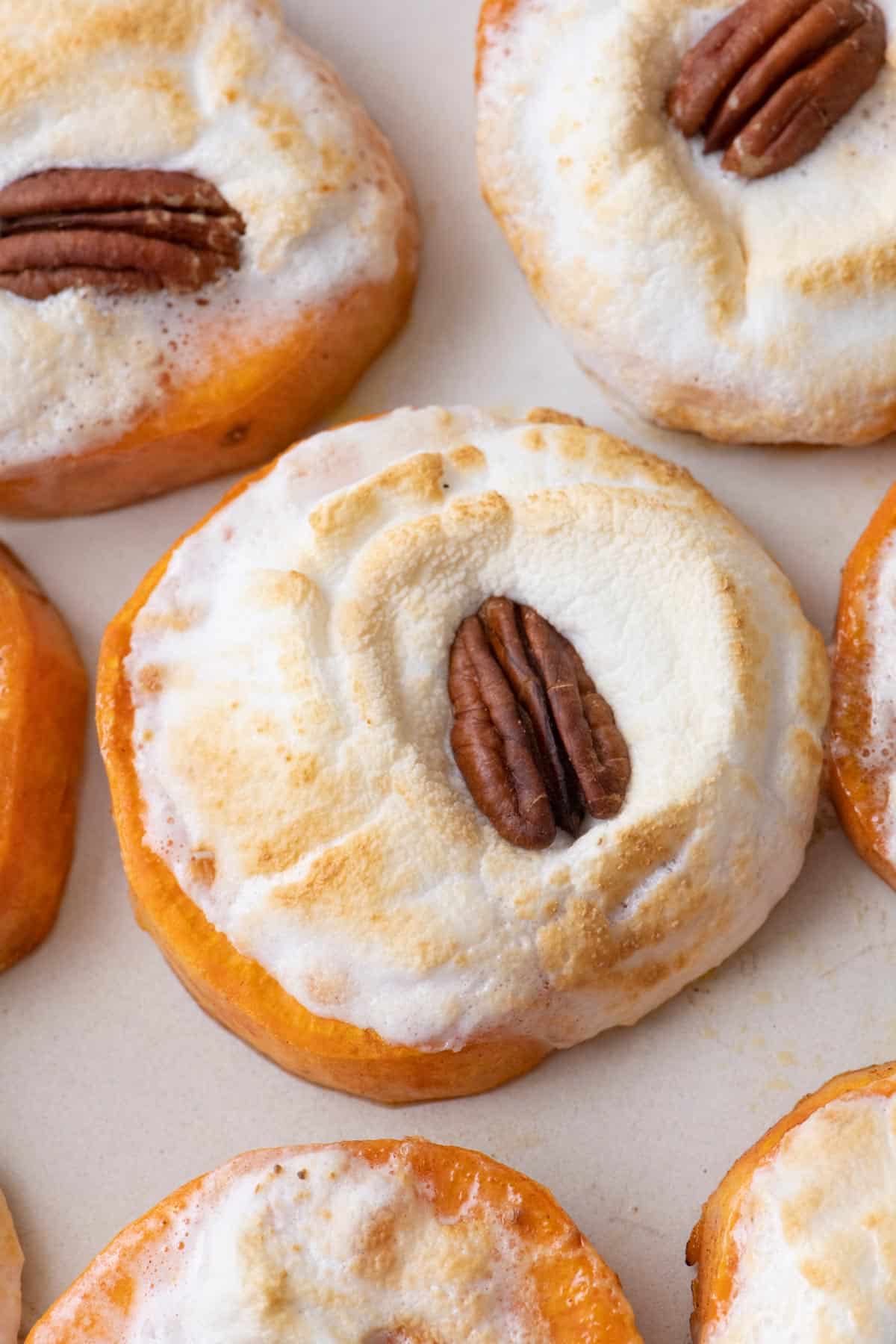 Close up of the sweet potato bites with toasted marshmellows and pecans.