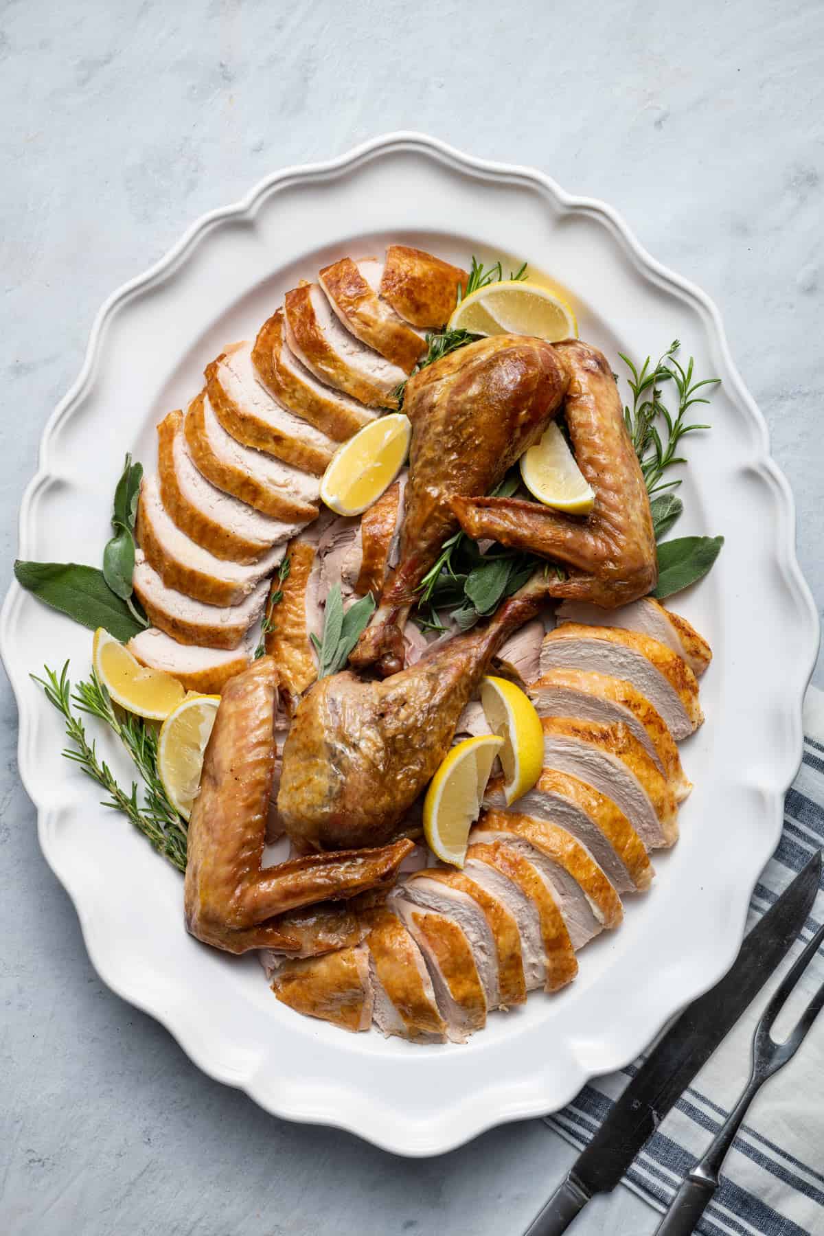 Thanksgiving turkey recipe on a table with all the side dishes
