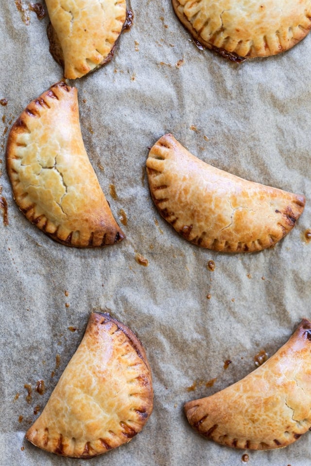 Baking sheet with the baked hand pies out of the oven