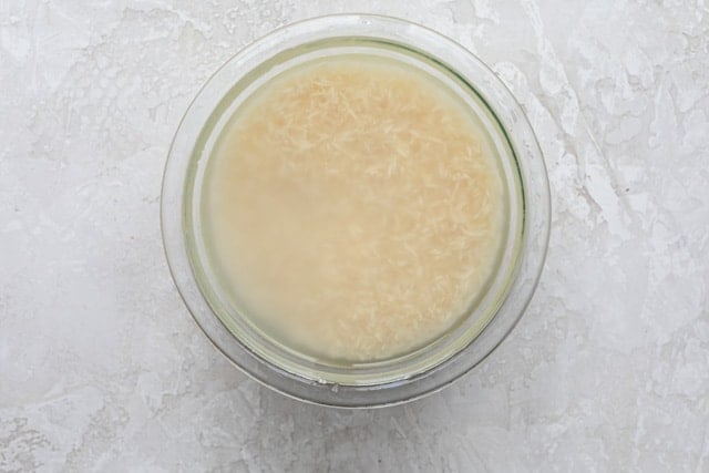 Soaking rice in a bowl with water
