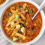 Bowl of vegetarian tortilla soup.