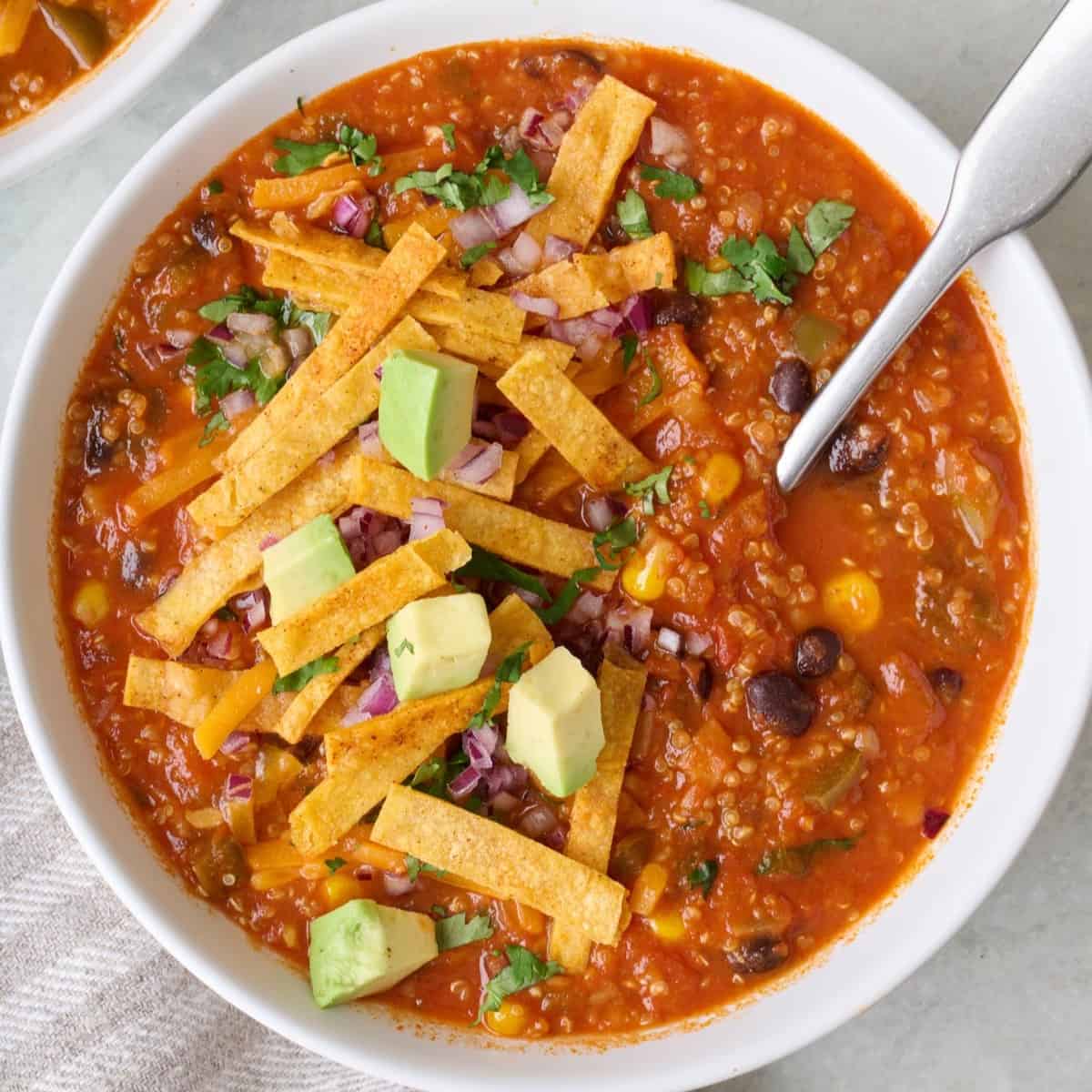 Bowl of vegetarian tortilla soup.