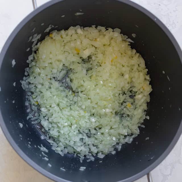Onions cooked down in pot.