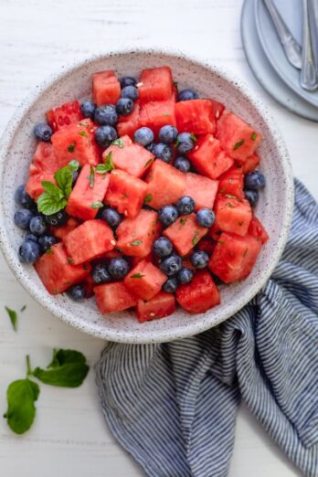 Watermelon Blueberry Salad in a large bowl with mint, honey and lemon juice