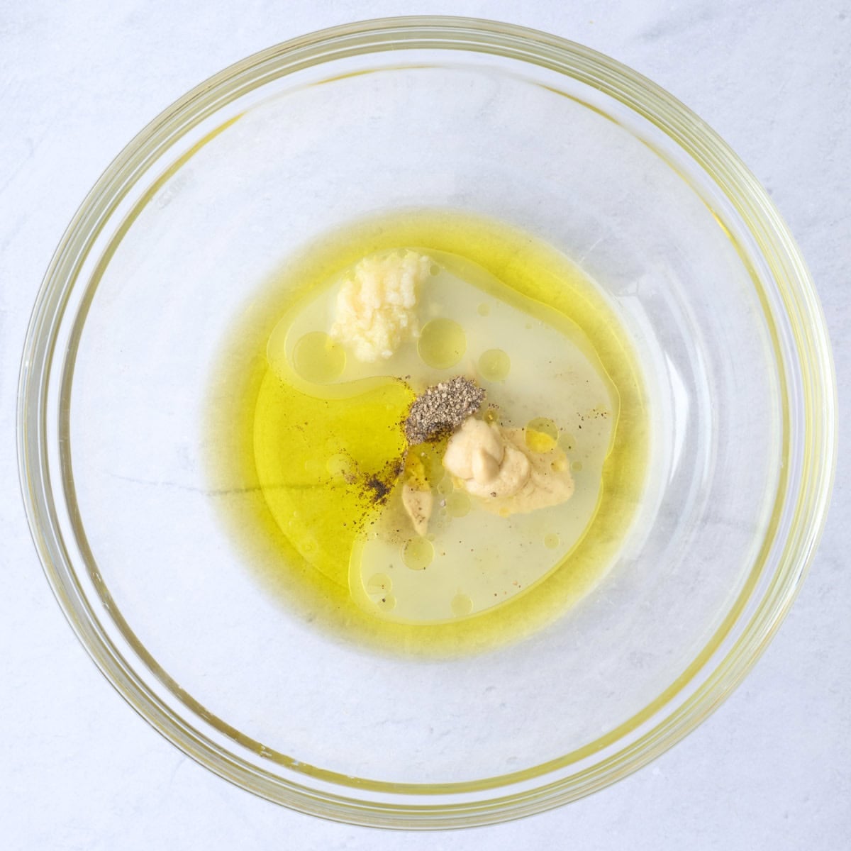Dressing ingredients in a large bowl.