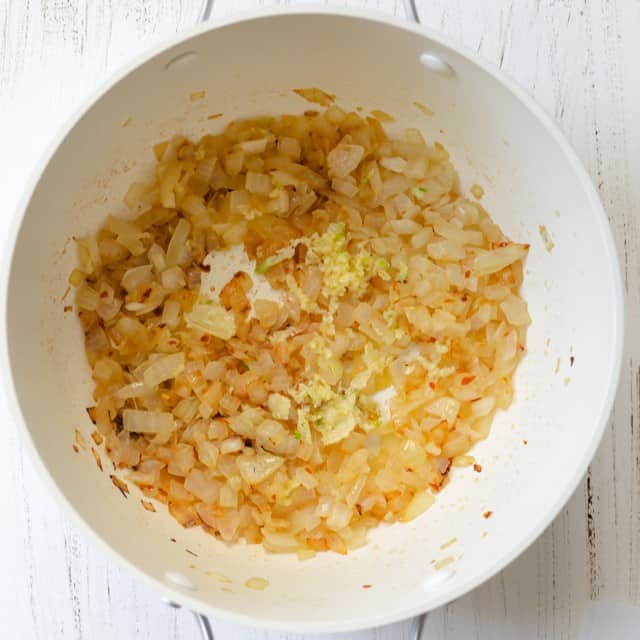 Cooked onions in a pot.