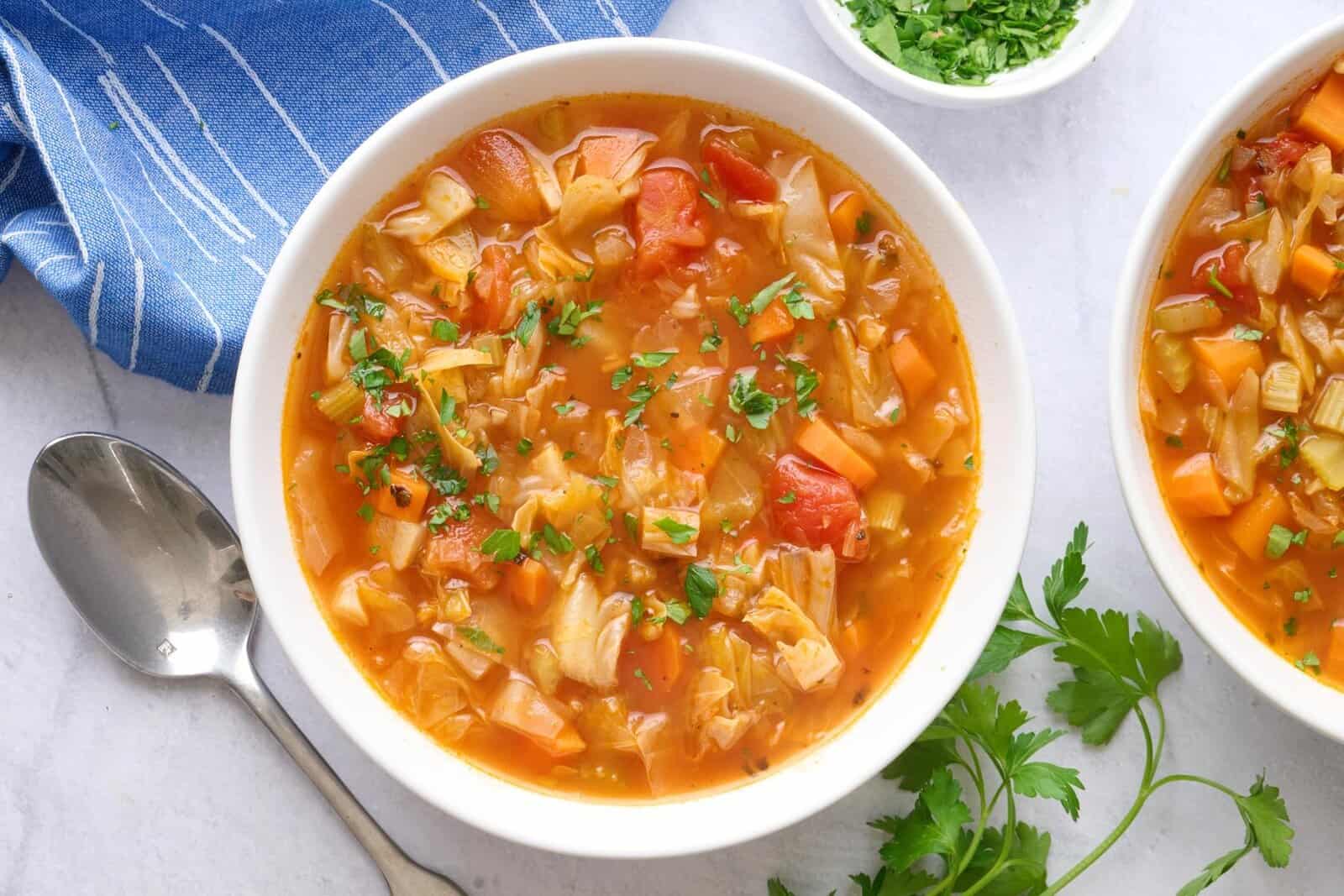 Two bowls of cabbage soup.