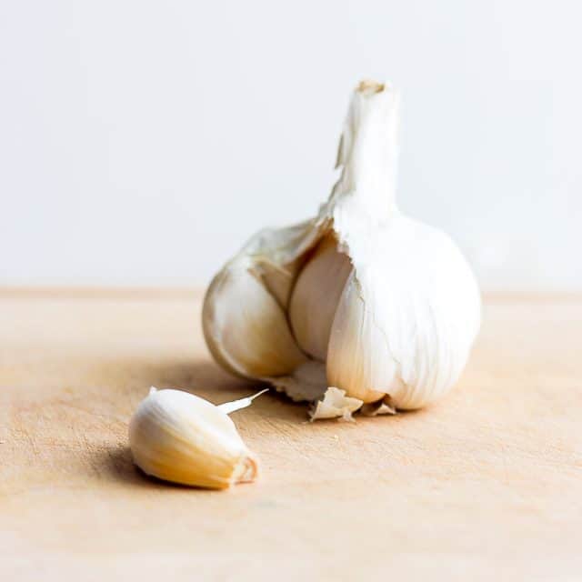 Garlic bulb with one garlic clove removed