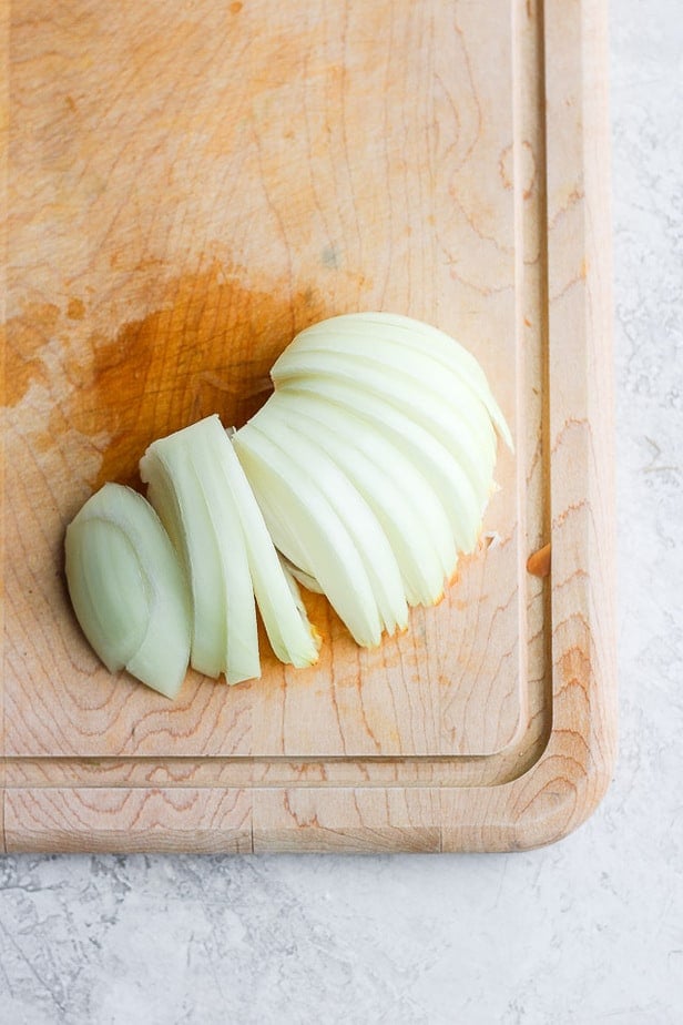 Sliced onions on cutting board