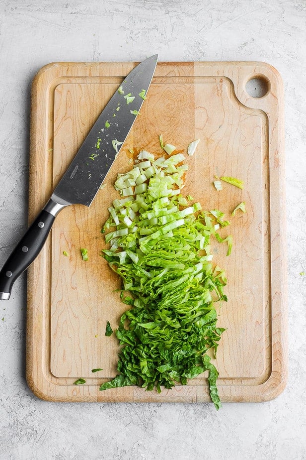 chopped lettuce on a chopping board