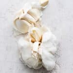 Garlic bulb with cloves peeled away