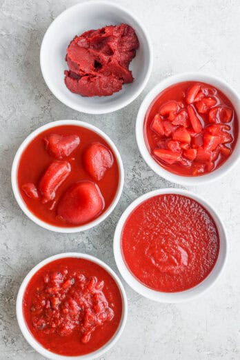 5 types of canned tomatoes shown in white bowls