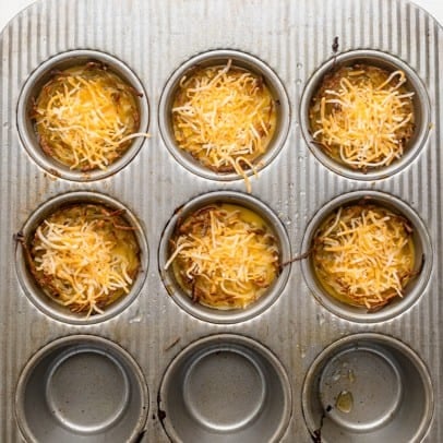 After adding the egg mixture, cooking, then adding cheese.