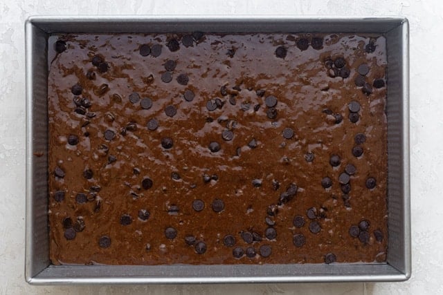 The brownie mixture in a baking pan