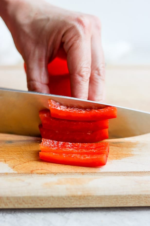 knife cutting pepper into slices