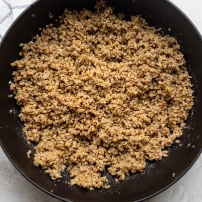 Freekeh fluffed with onions.