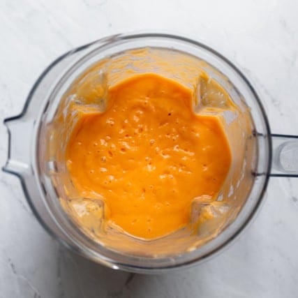 Smoothie ingredients in a blender after blending.