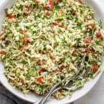 Large bowl of Lebanese cabbage salad with tomatoes and cilantro