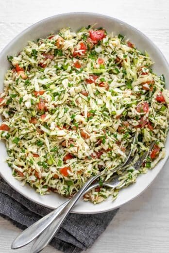 Large bowl of Lebanese cabbage salad with tomatoes and cilantro