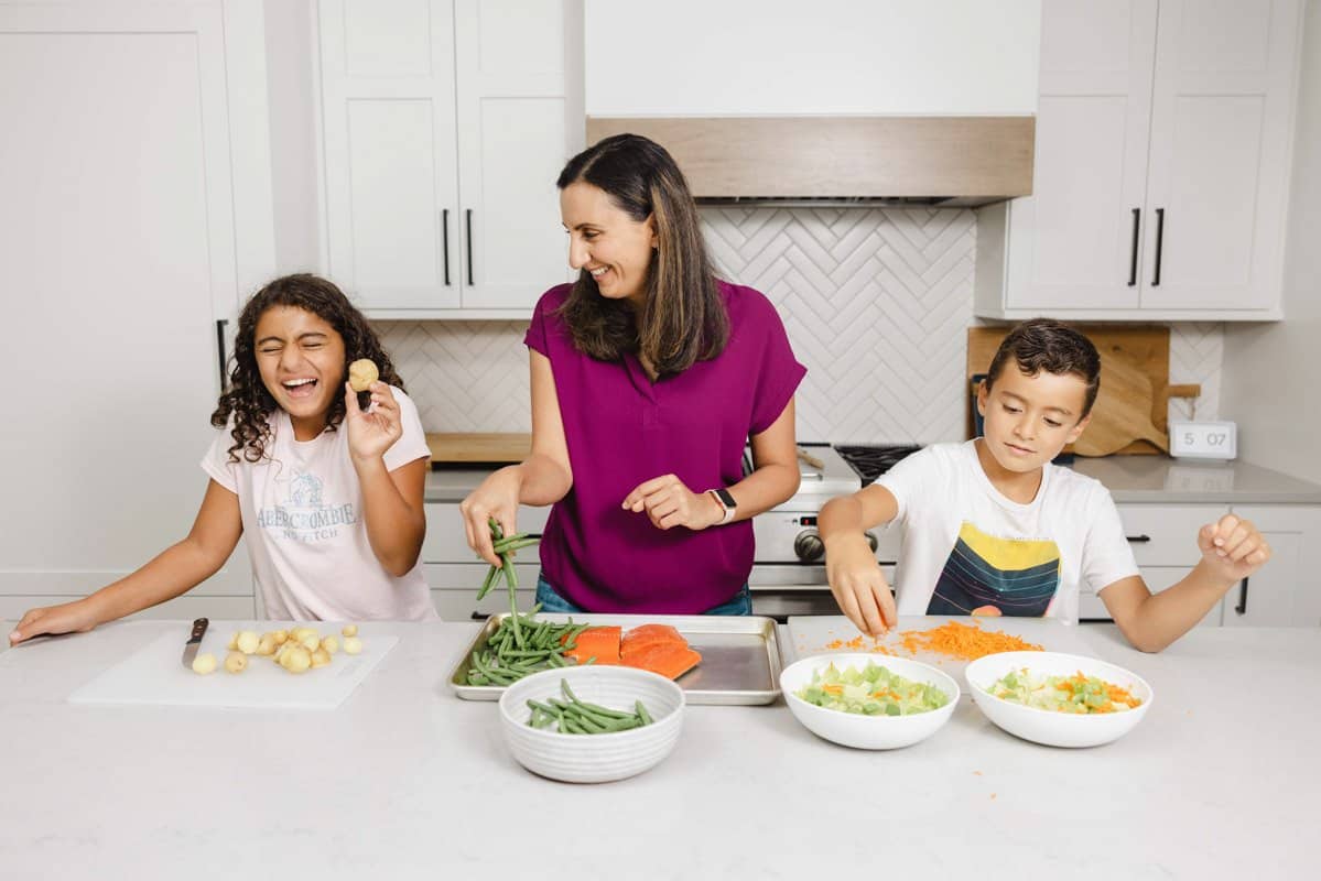 Yumna and kids in the kitchen preparing meal together