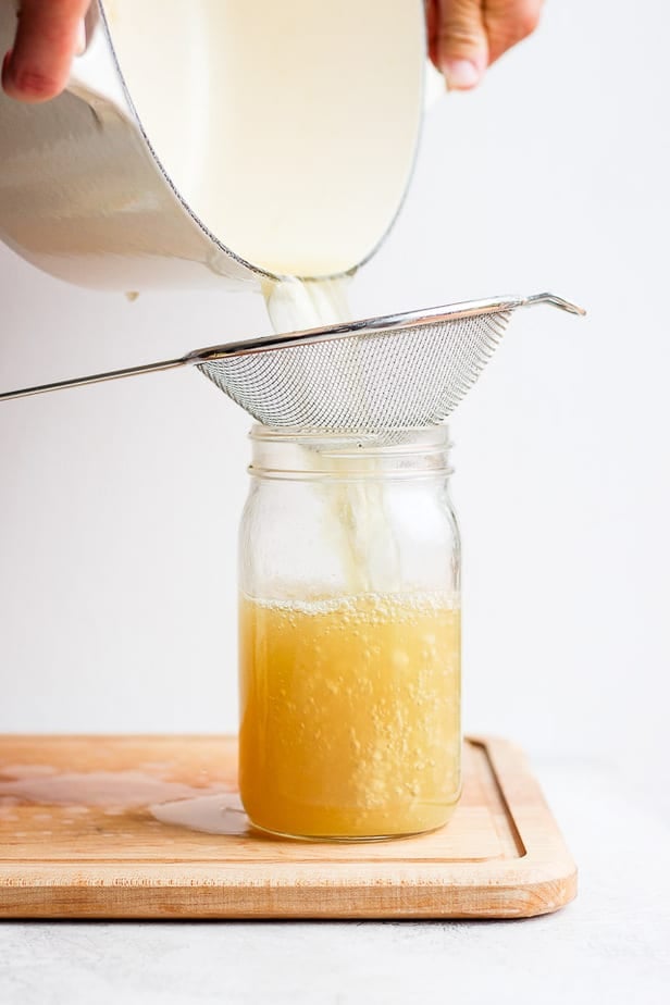 Straining the stock from a pot