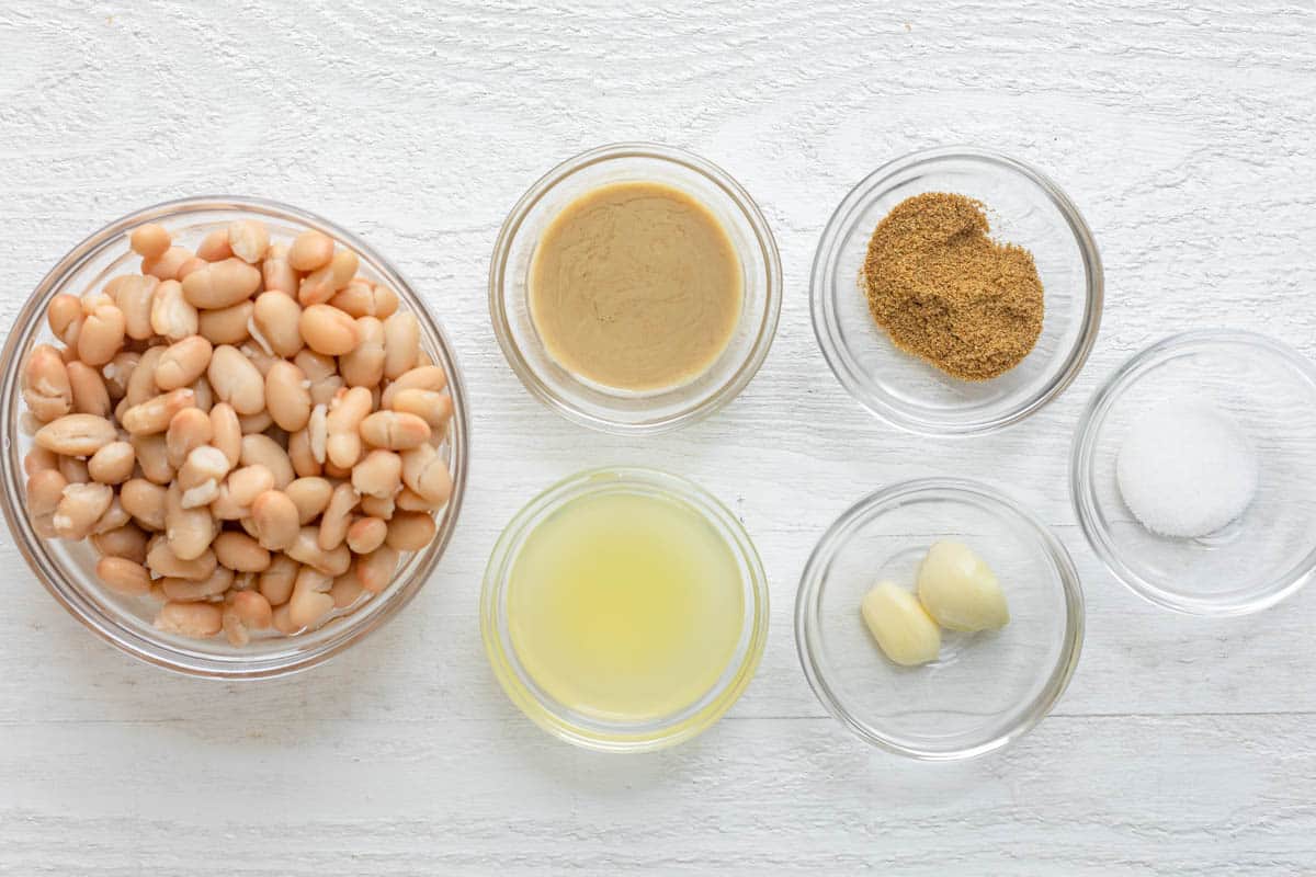 Ingredients to make the recipe in small bowls on white background