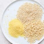 Three types of couscous on a white plate before cooking