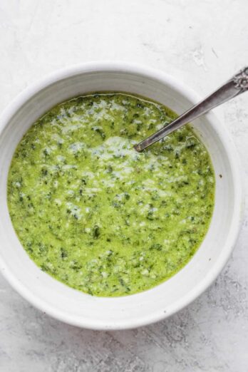 Bowl of pesto with spoon insdie