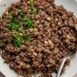 Lebanese hashweh with spoon scooping out serving