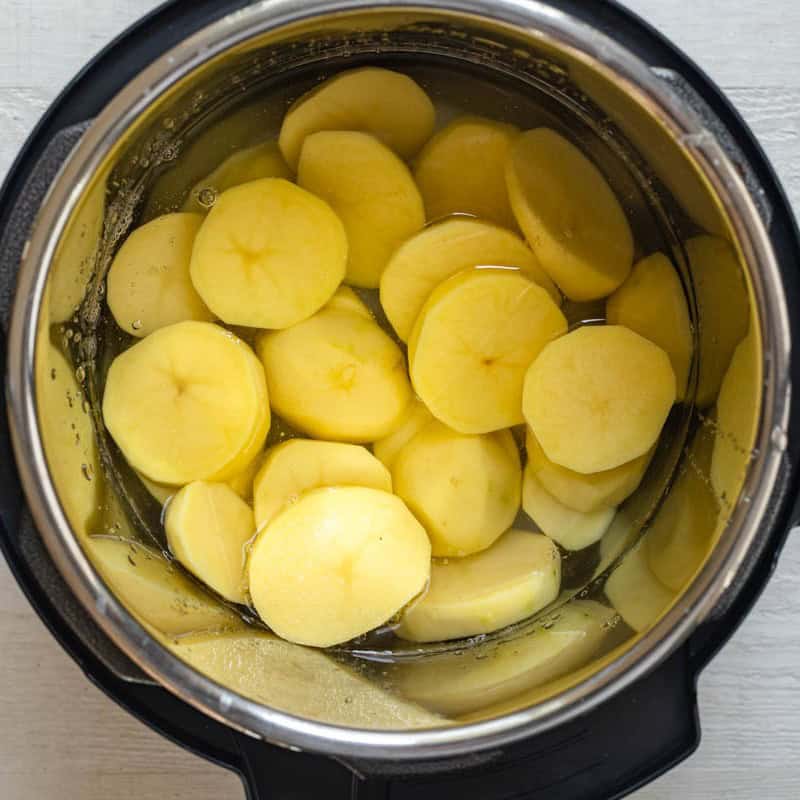 Cut potatoes in the instant pot with water added.