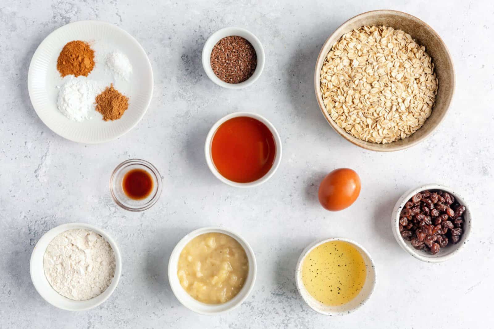Ingredients for recipe: spices, flour, vanilla, avocado oil, maple syrup, flax seeds, mashed banana, and egg.