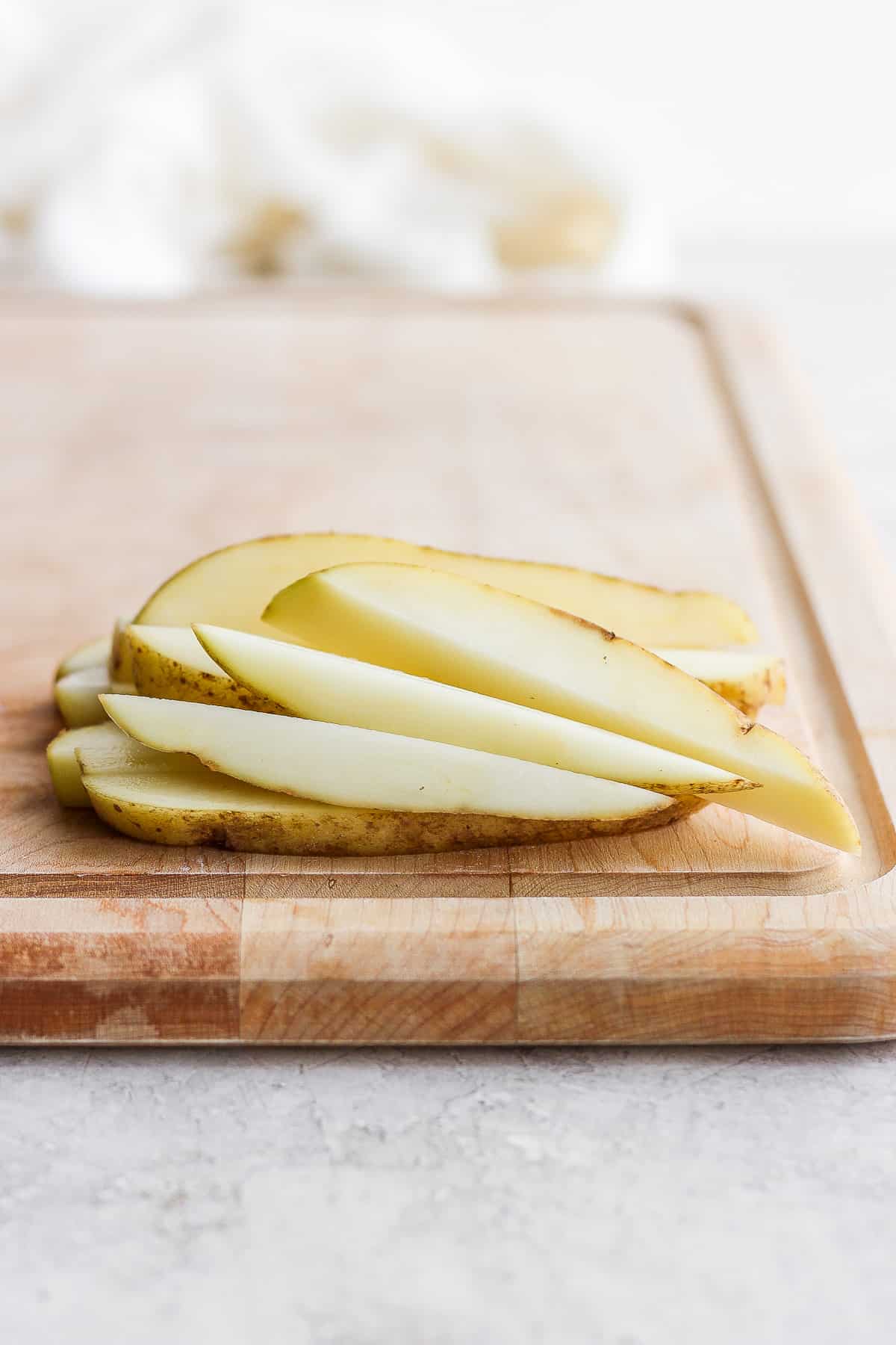 Potato sticks cut on a cutting board