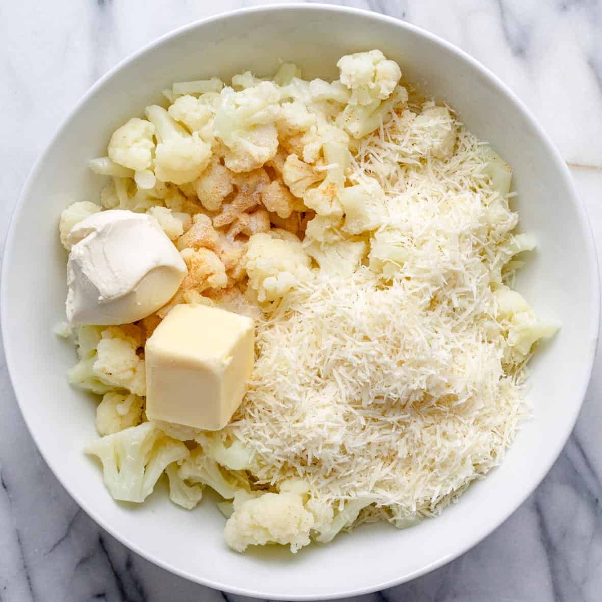 The rest of the cauliflower mashed potatoes added to the bowl of cauliflower.