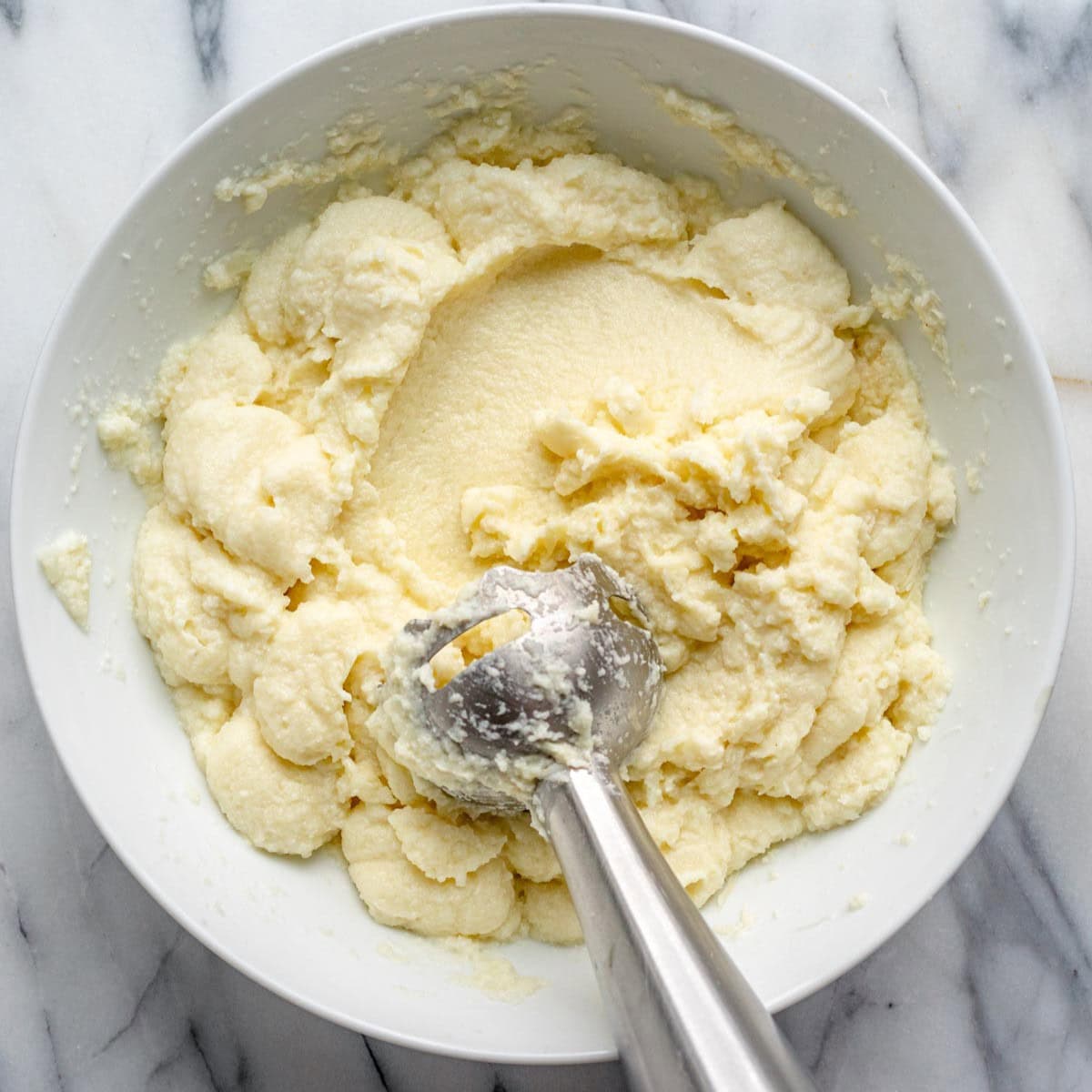 Mashed cauliflower in a bowl after blending.
