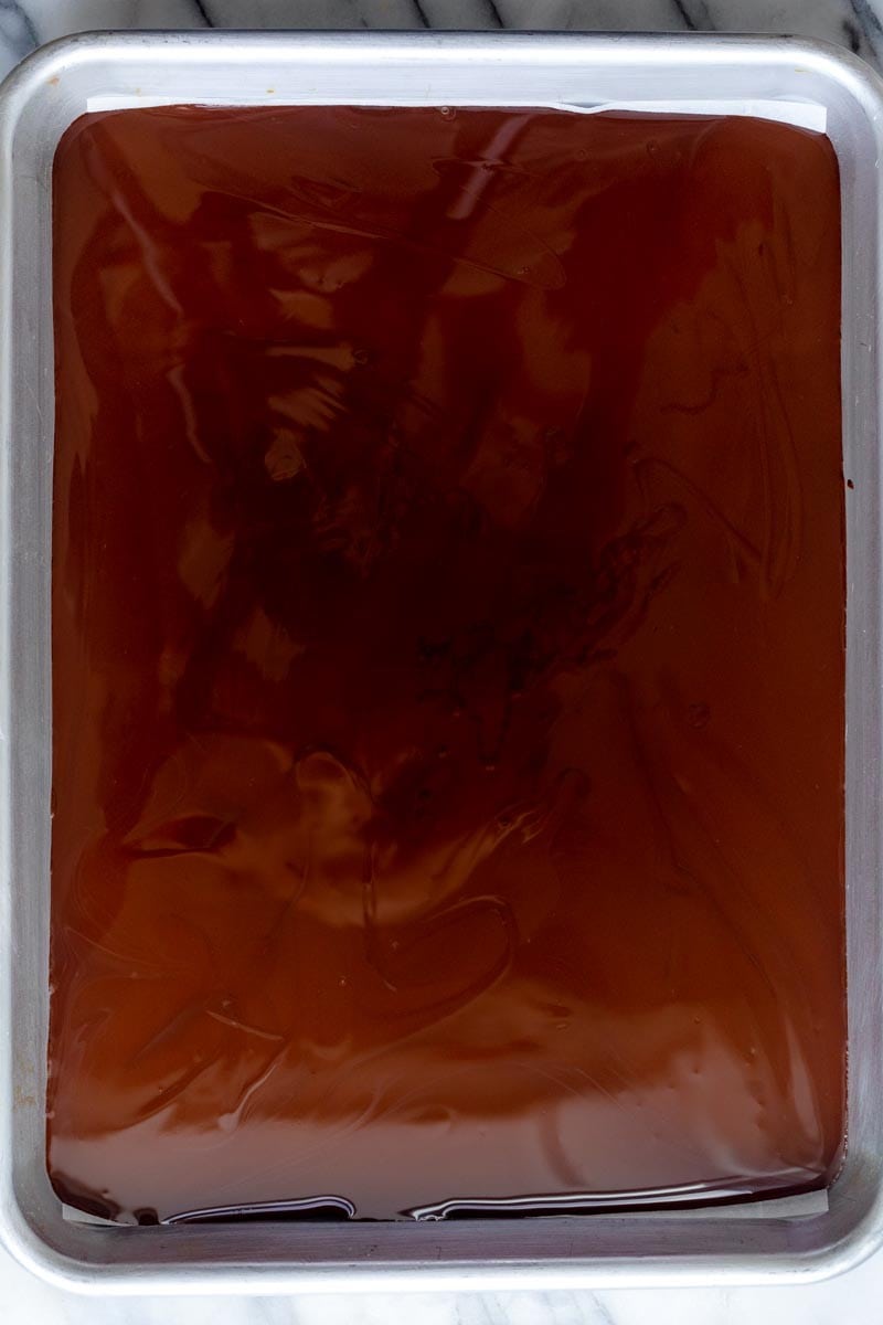 Dark chocolate transferred into a baking sheet.