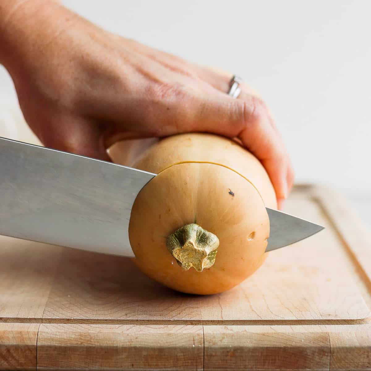 Squash on its side cutting through the top.