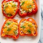 Tuna melt stuffed inside red bell peppers baked in the oven