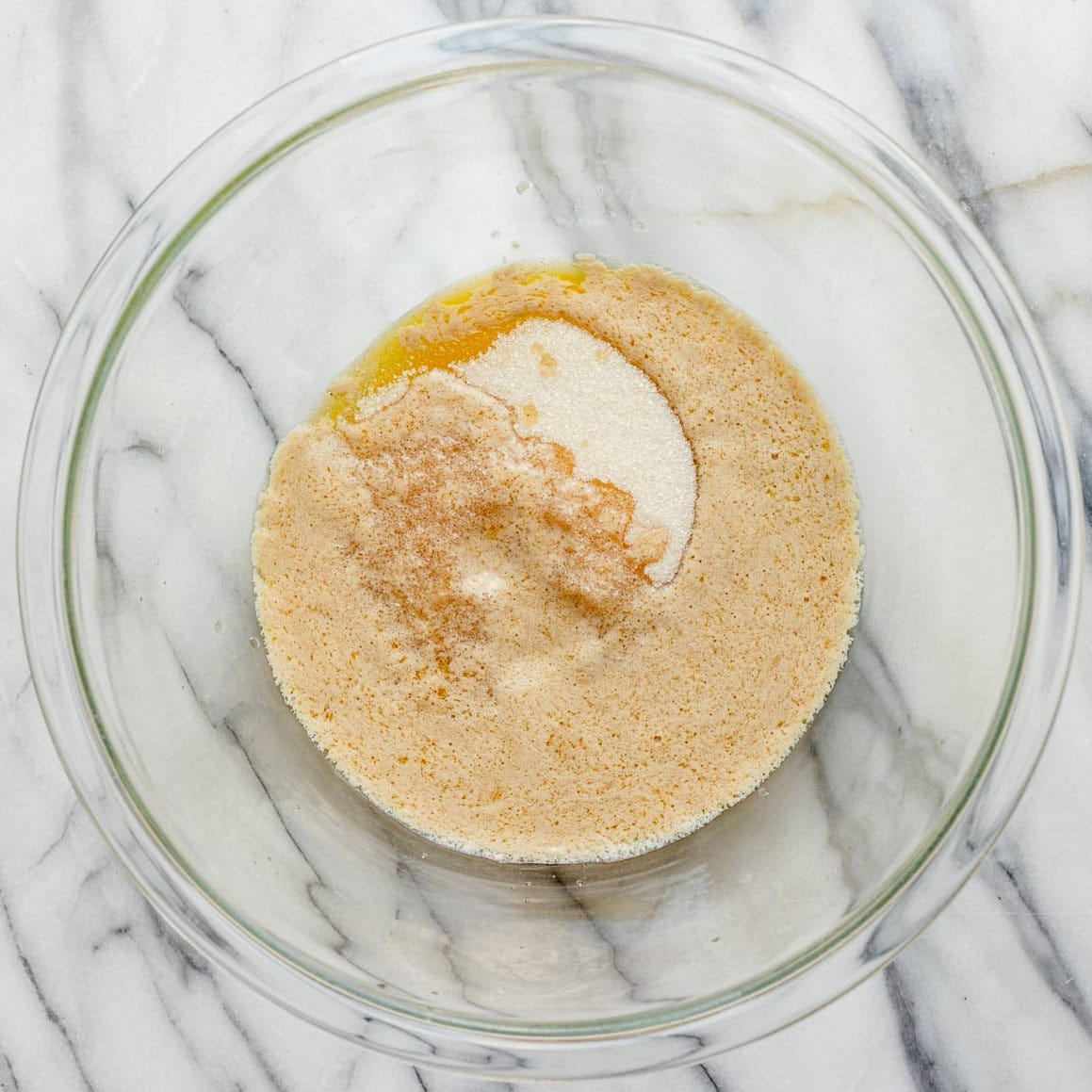 Butter and sugar in a bowl.