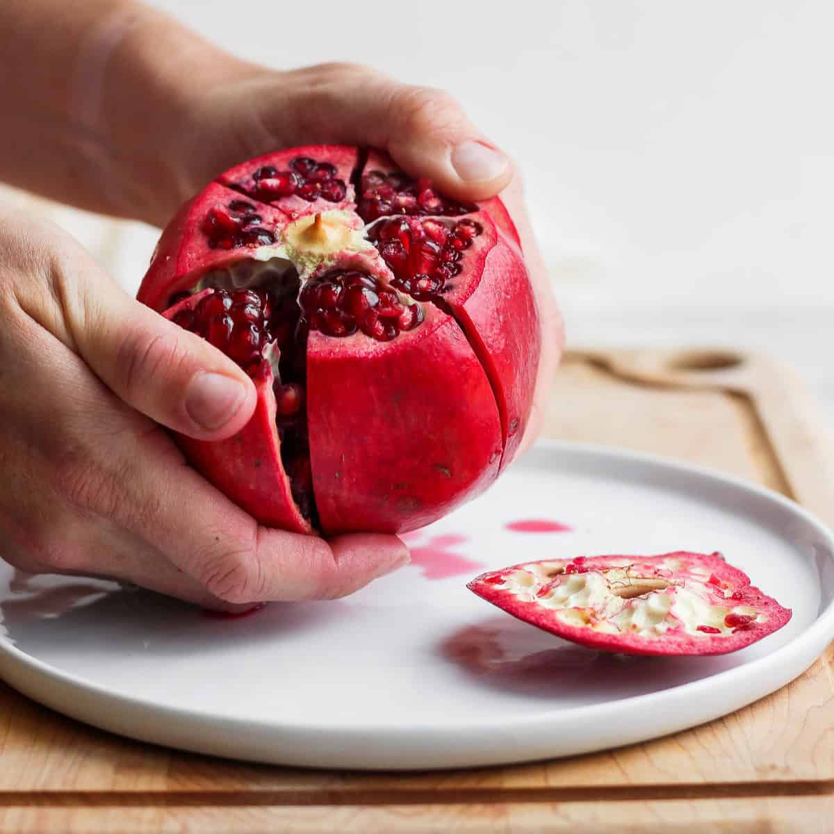 Peeling open the pomegranate.