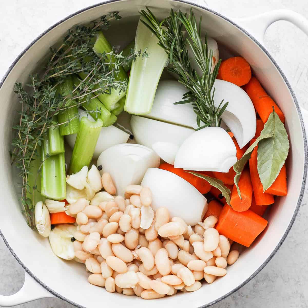 All of the vegetable stock ingredients in a large pot.